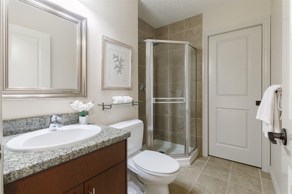 Bathroom with a corner glass shower